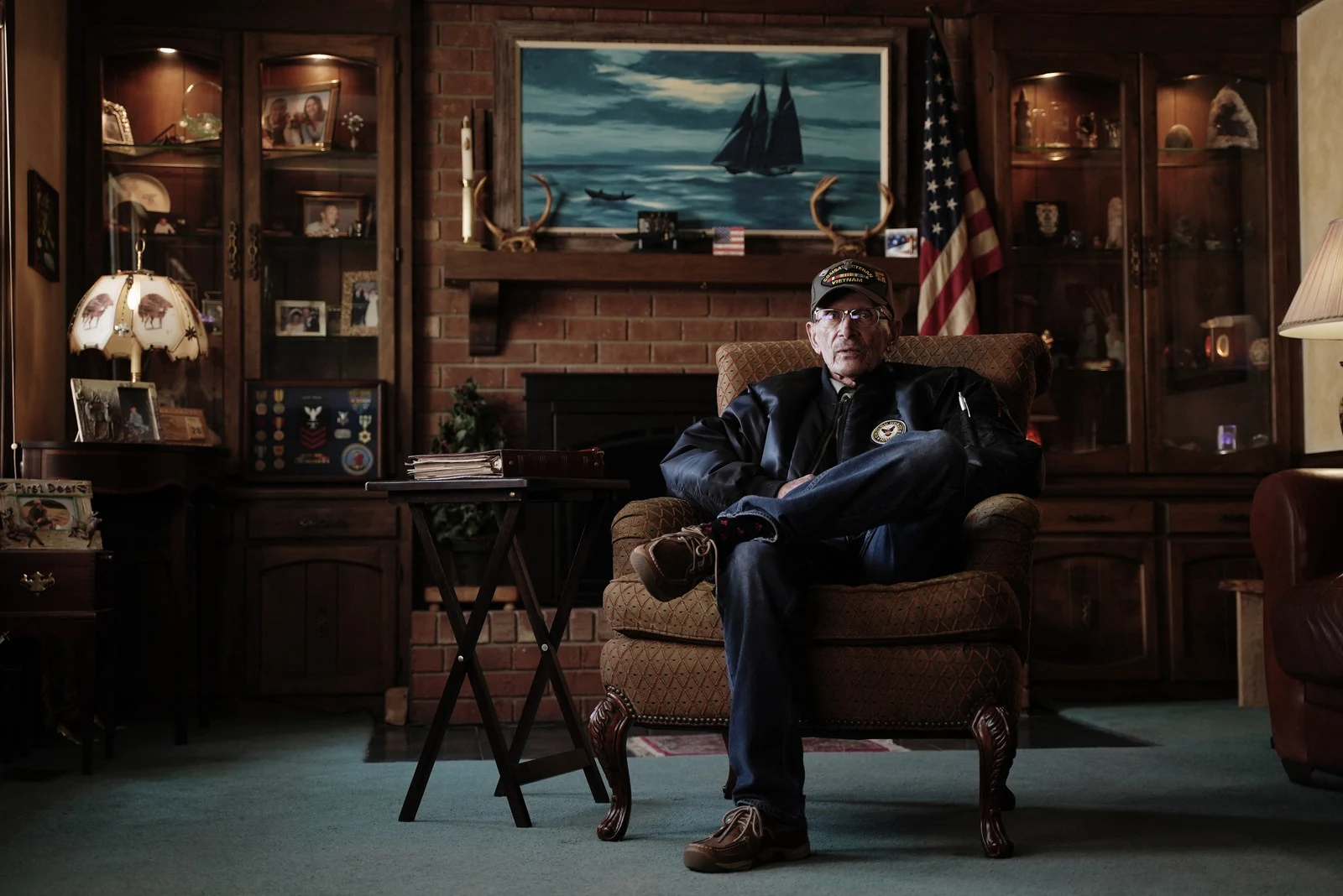 A veteran in a wood-paneled room, from War Stories