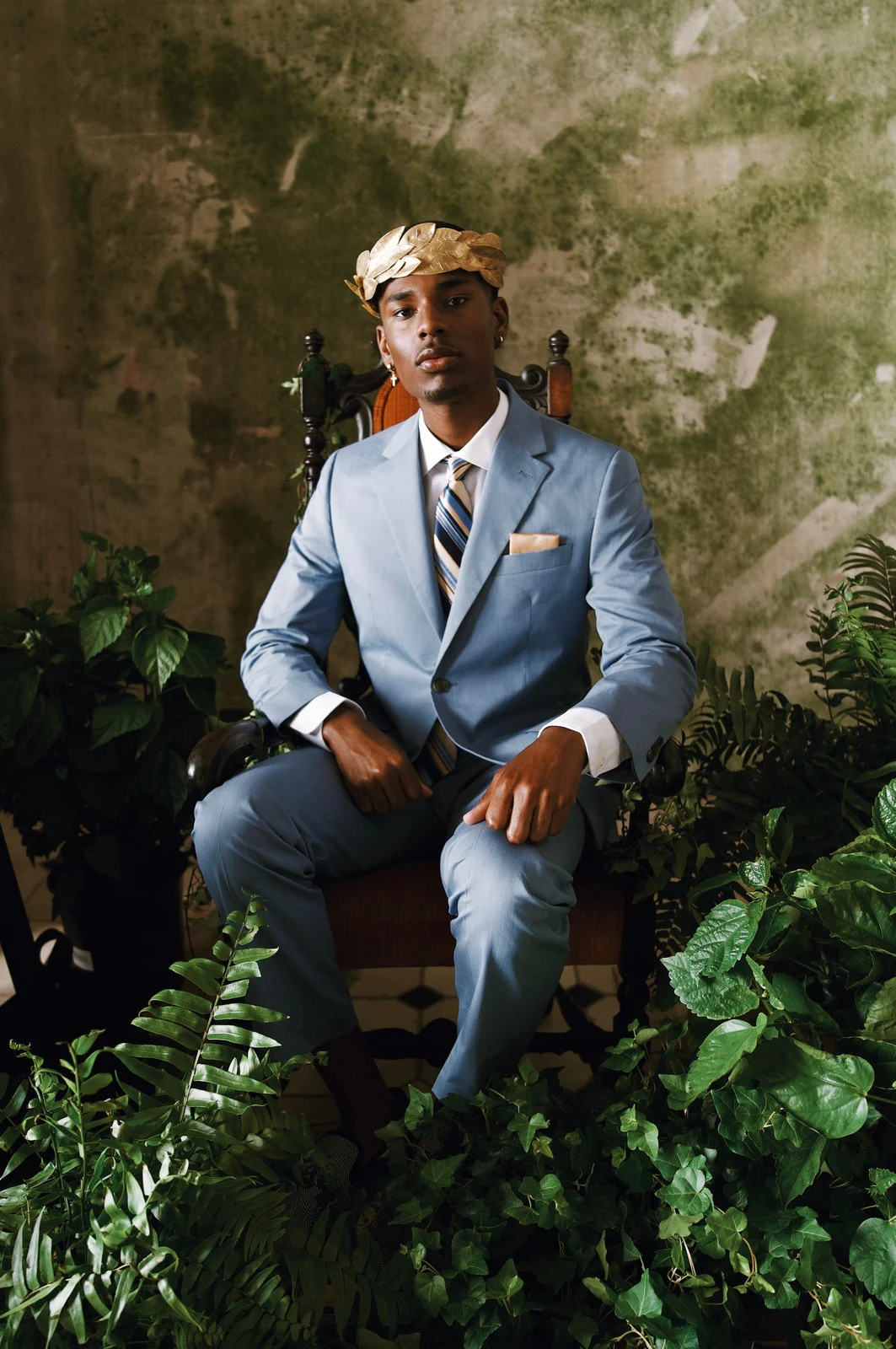 A portrait in a pale blue suit