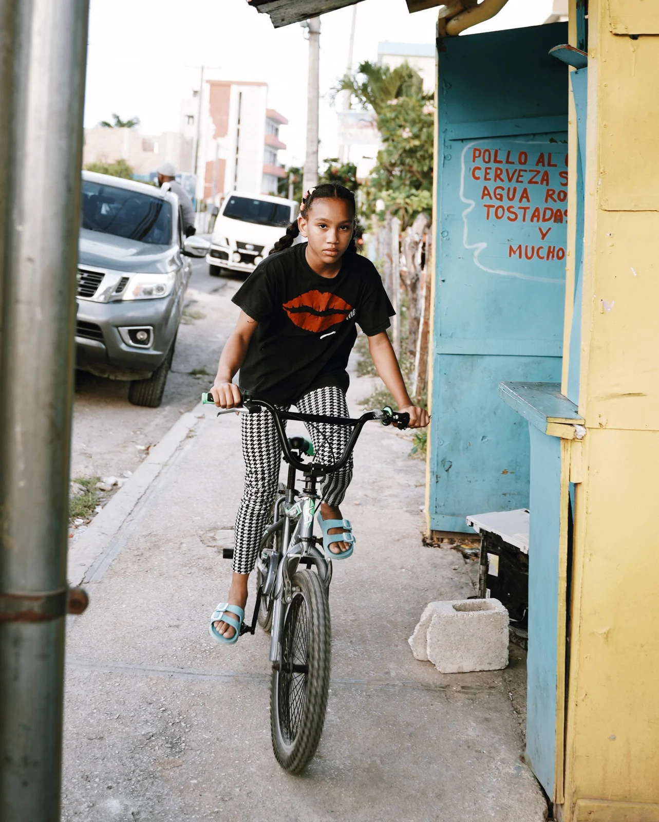 A cyclist passing a doorway
